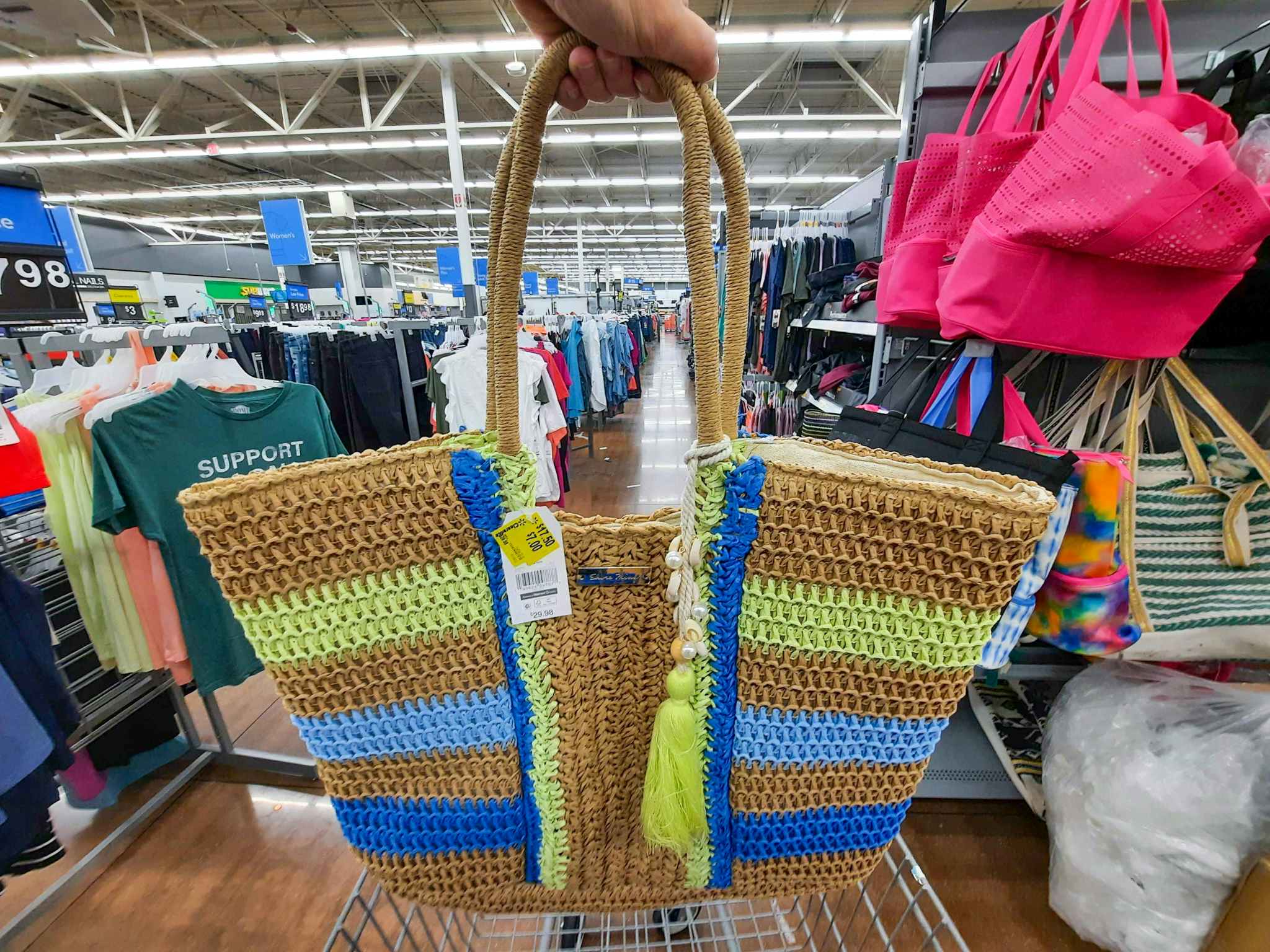 hand holding time and tru adrenaline lime raffia tote at walmart