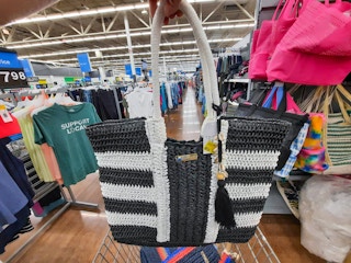 hand holding time and tru black and white raffia tote at walmart