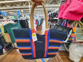 hand holding time and tru dark navy americana raffia tote at walmart