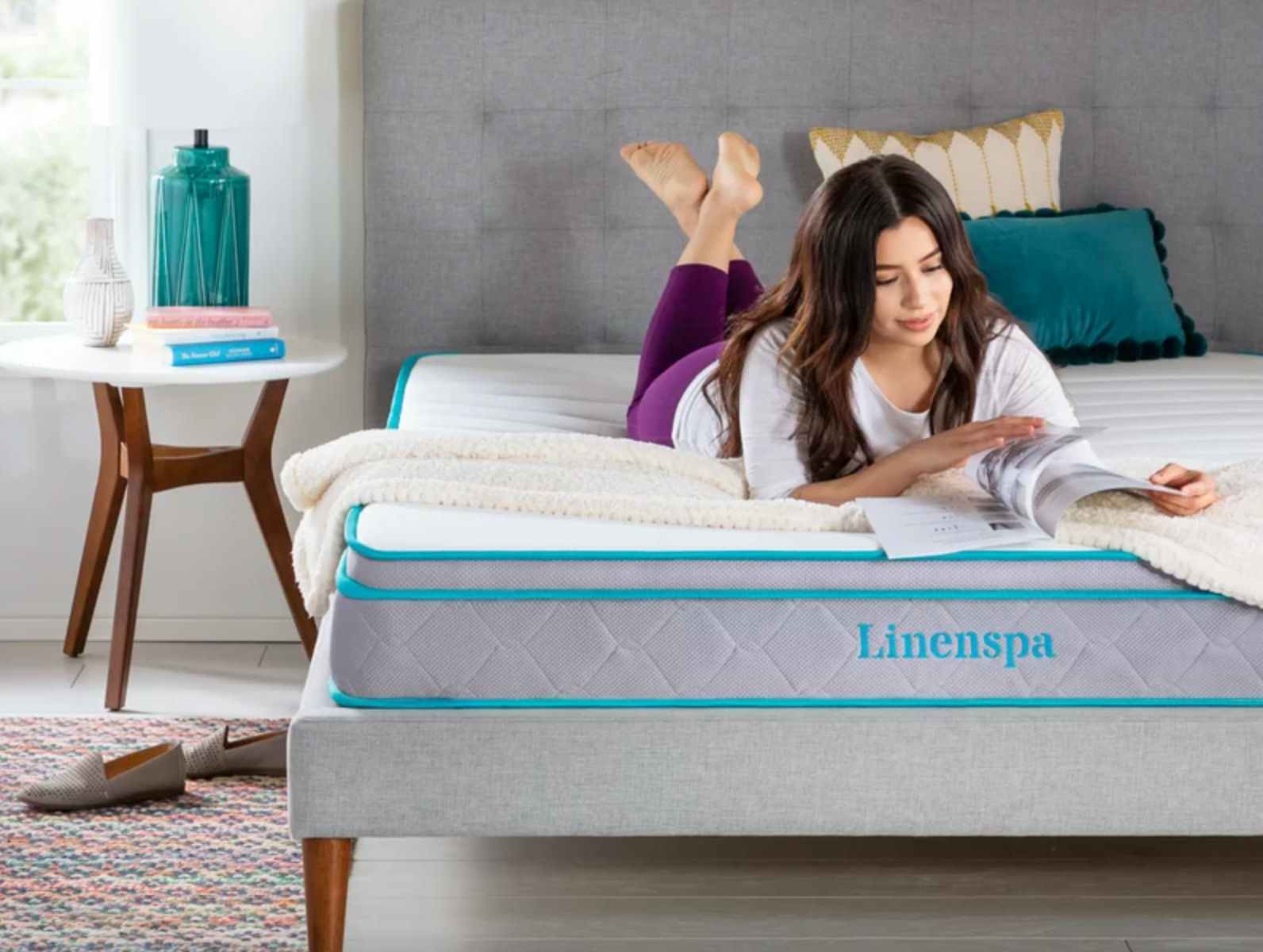 A person lying down on a Linenspa Queen-Size Memory Foam Mattress from Wayfair staged in a bedroom.
