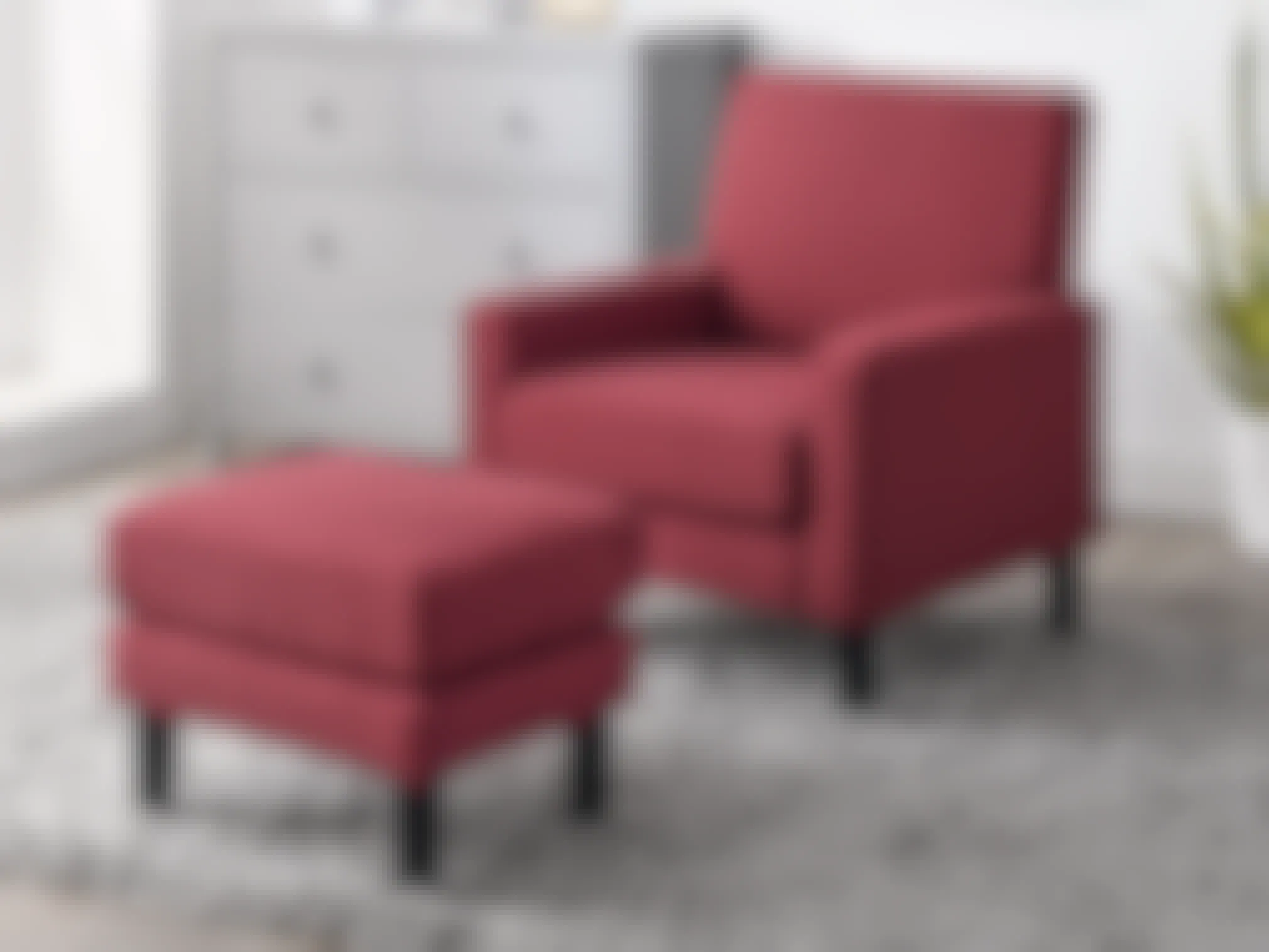 An Armchair and Ottoman Set from Wayfair staged in a living room.