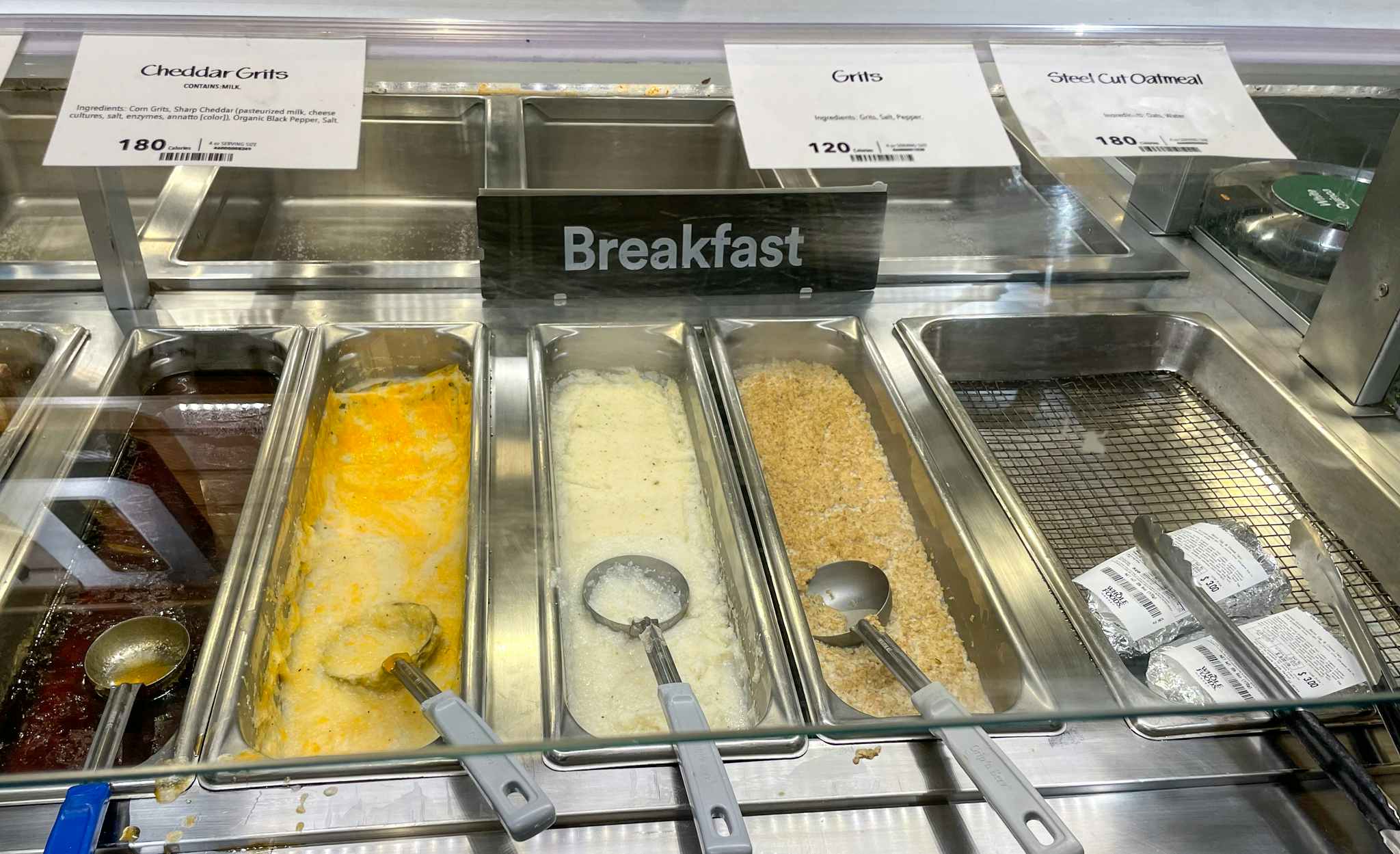 oatmeal grits and syrup in a hot bar at whole foods