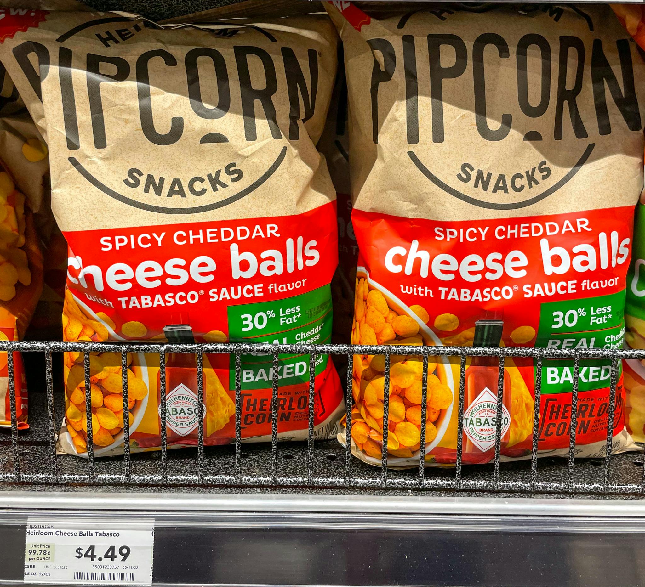pipcorn tabasco flavor on a shelf with sales tag at whole foods 
