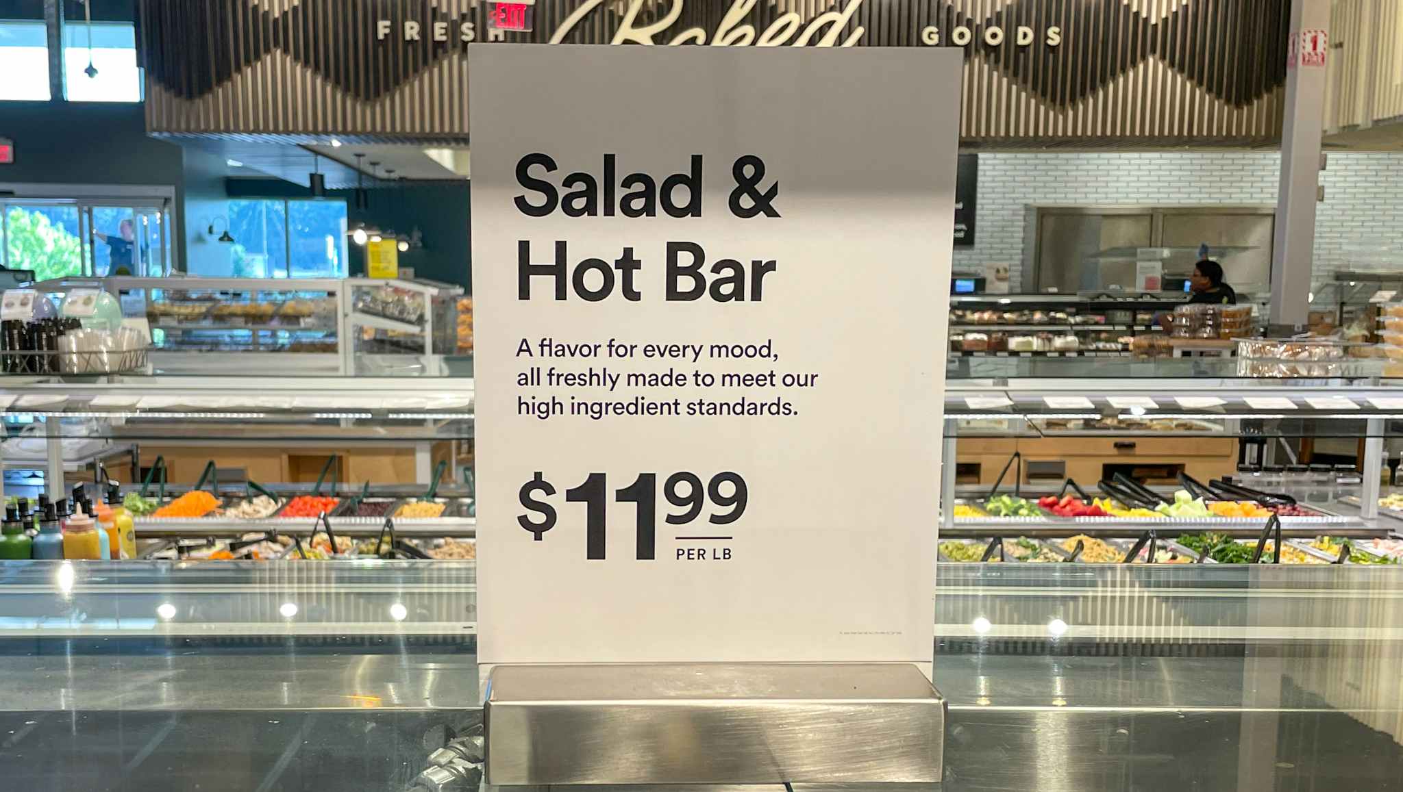 salad and hot bar sales sign at whole foods 