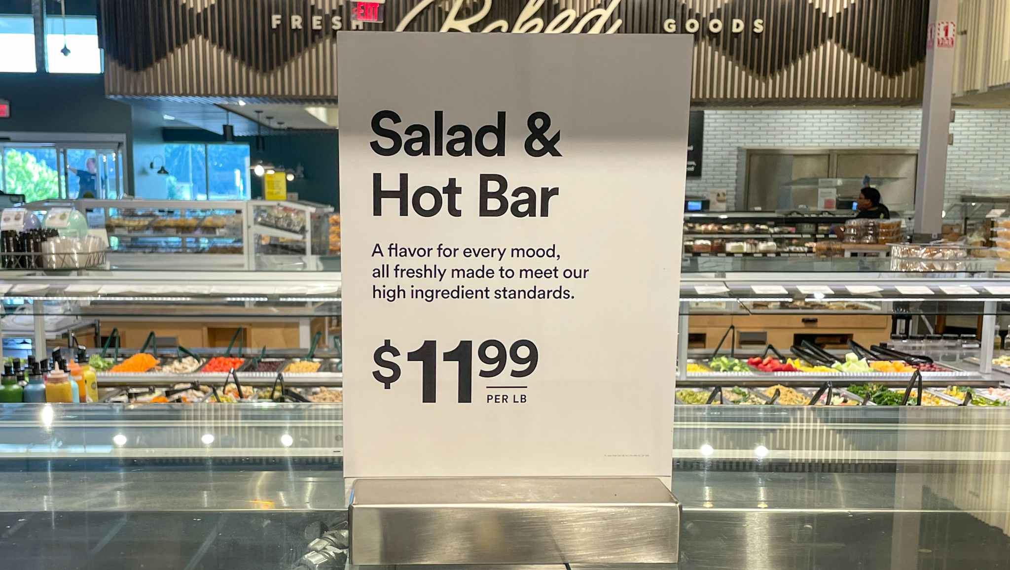 salad and hot bar sales sign at whole foods