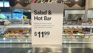 salad and hot bar sales sign at whole foods