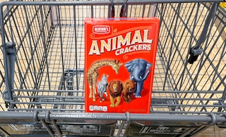 benton's animal crackers in a box in a cart at aldi