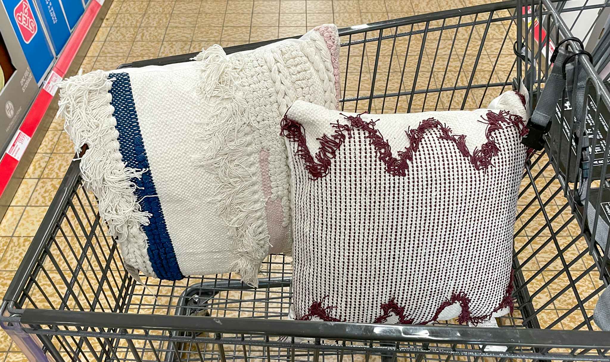 decor pillows in a cart at aldi