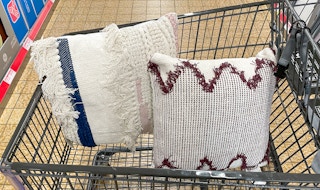 decor pillows in a cart at aldi
