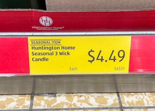 sale sign for candles at aldi