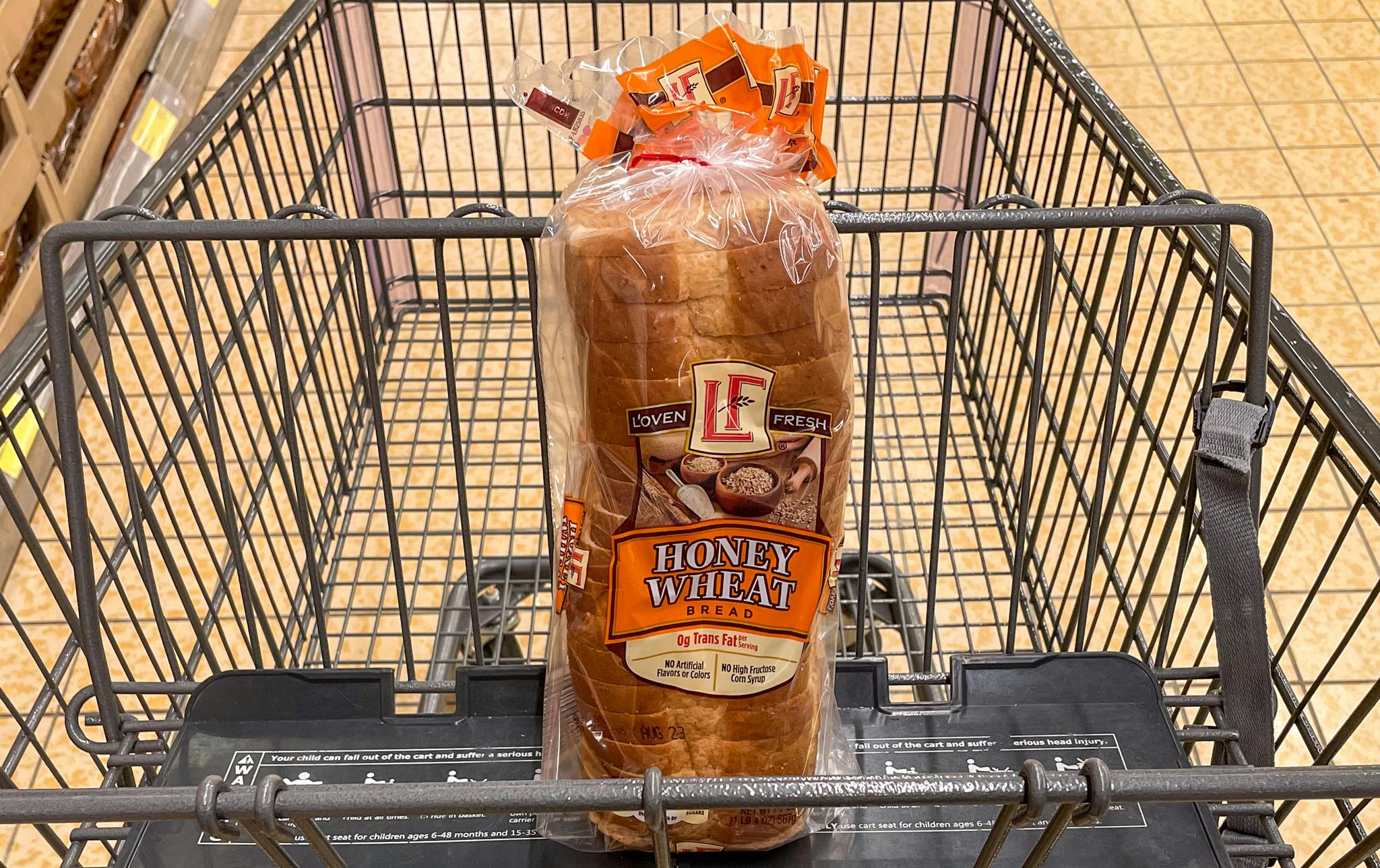 honey wheat bread in a cart at aldi 