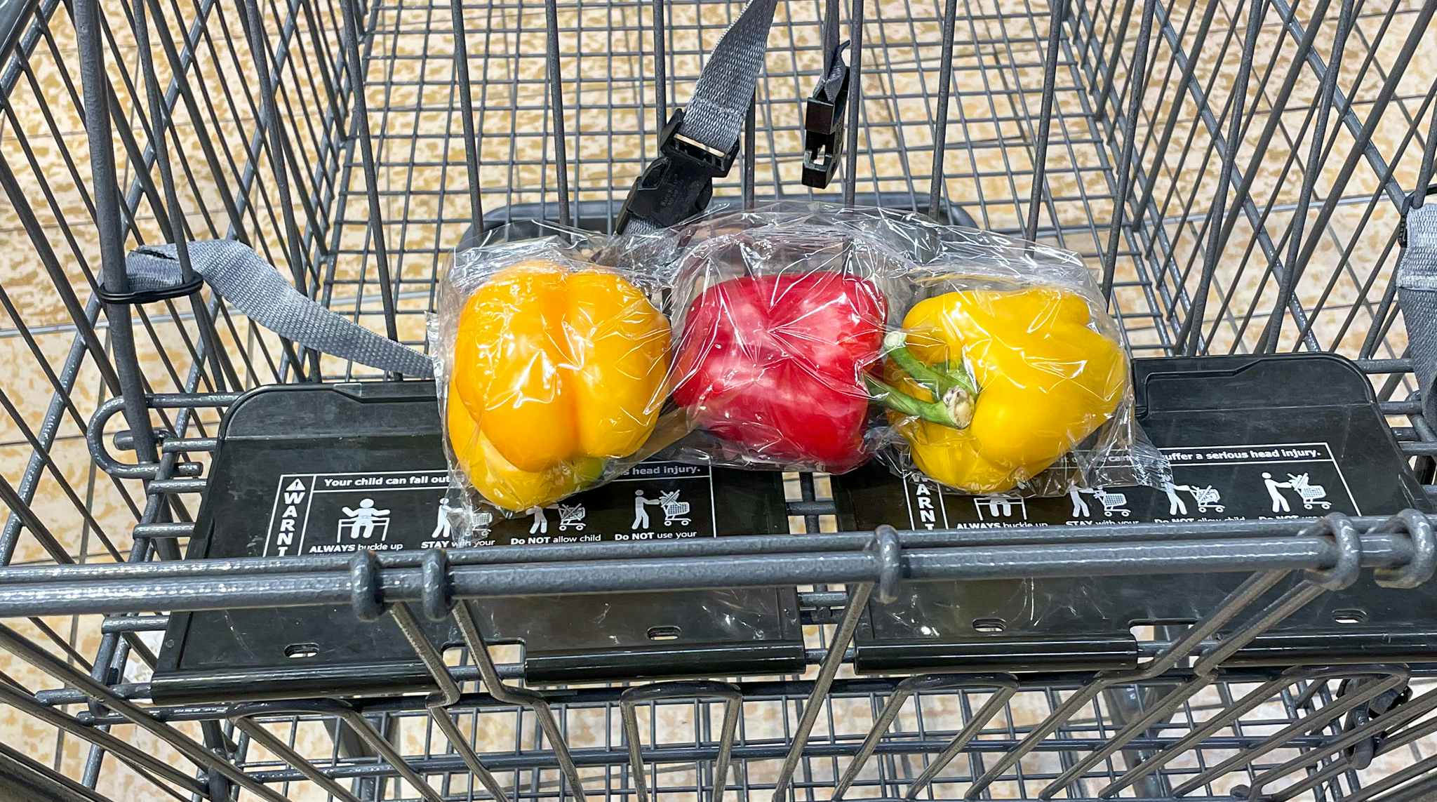 packaged bell peppers in a cart at aldi