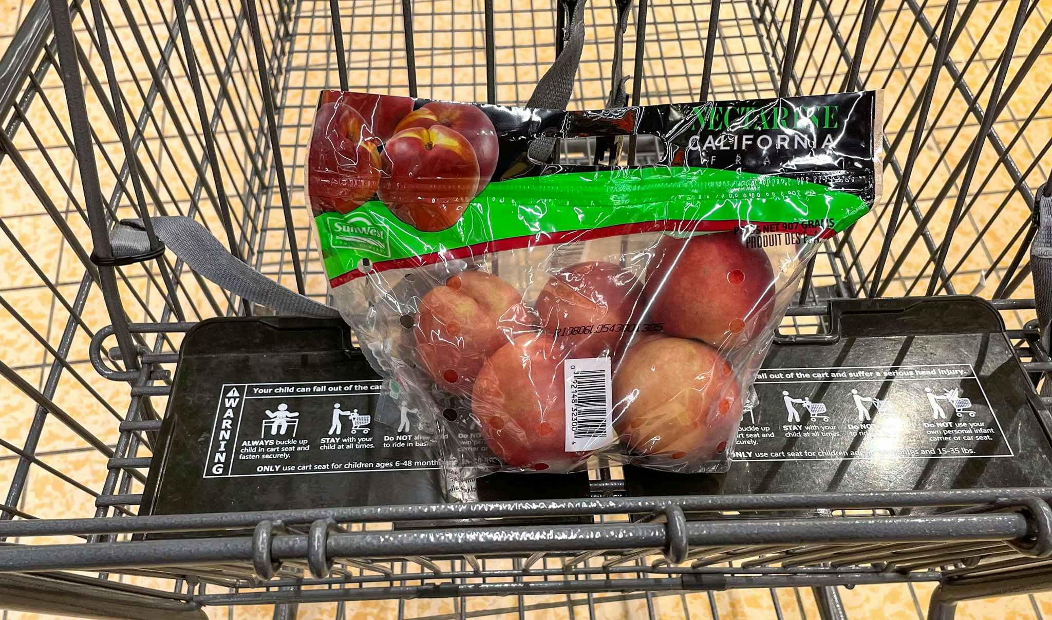 packaged nectarines in a cart at aldi