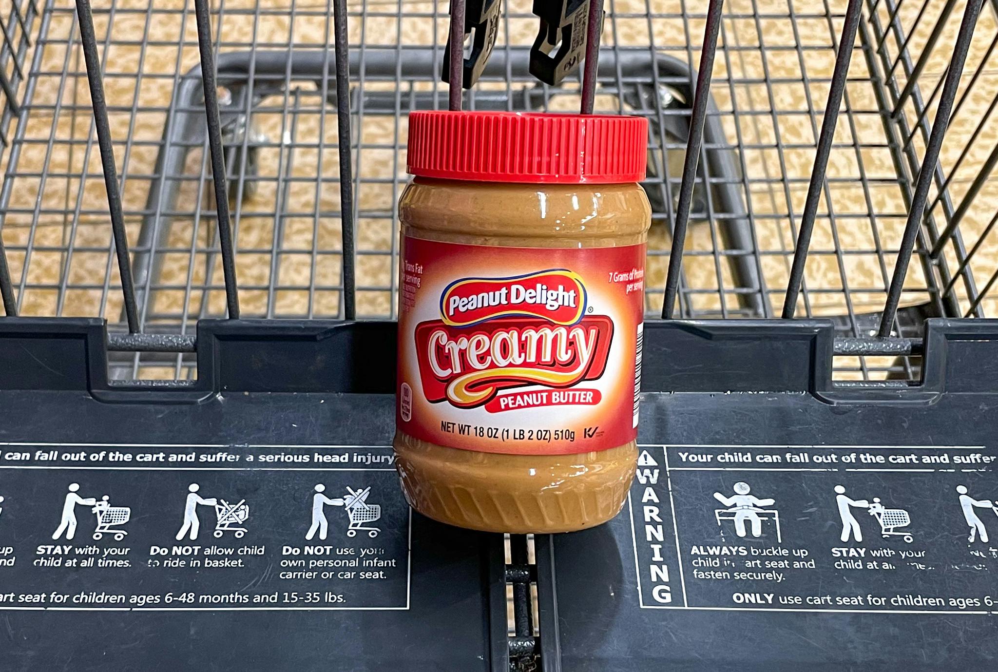 peanut butter in a cart at aldi 