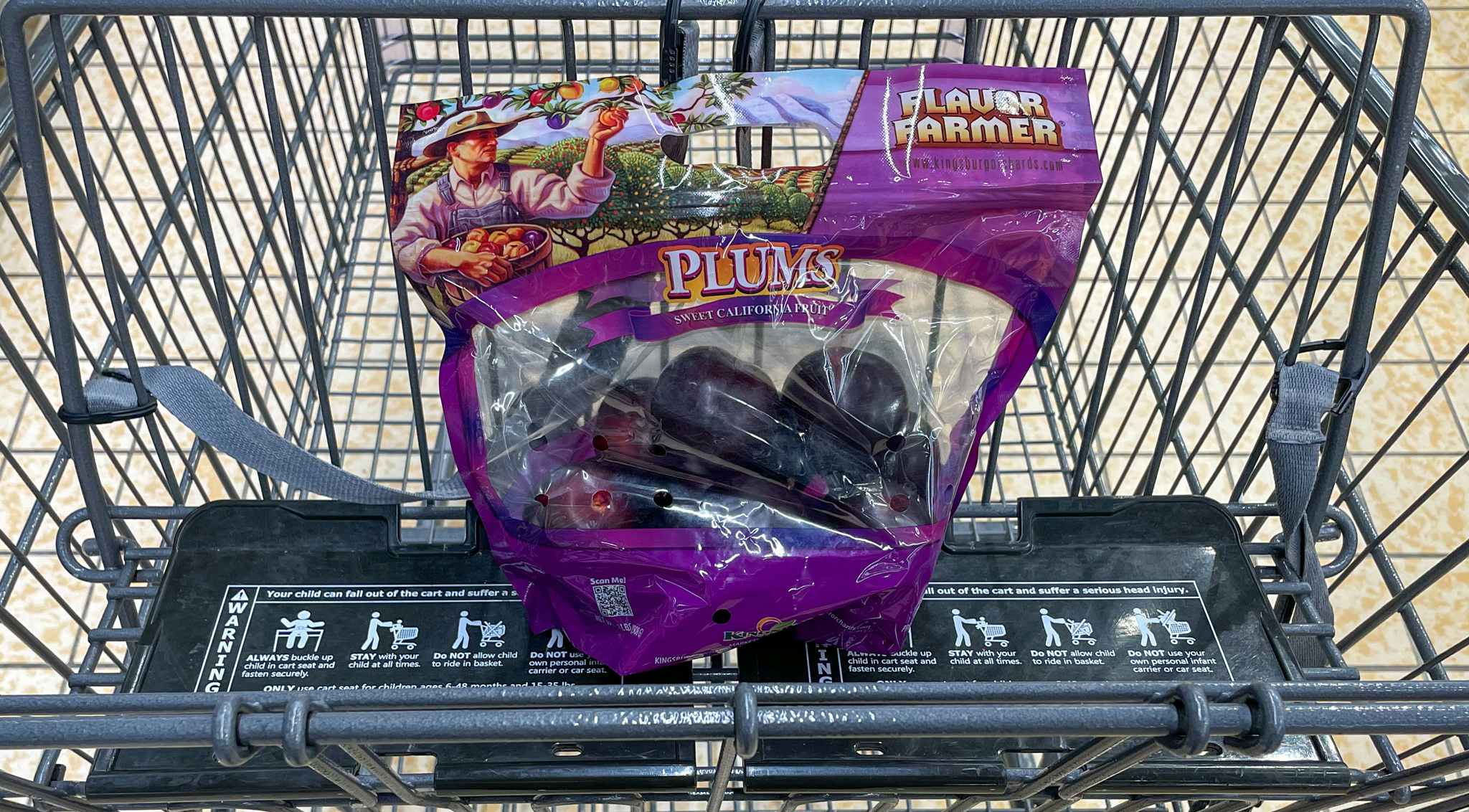 packaged plums in a cart at aldi