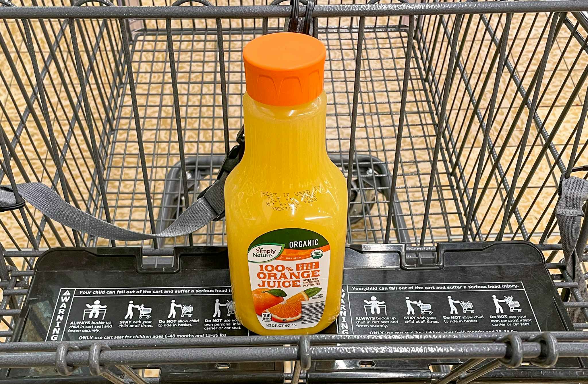 orange juice in a cart at aldi 