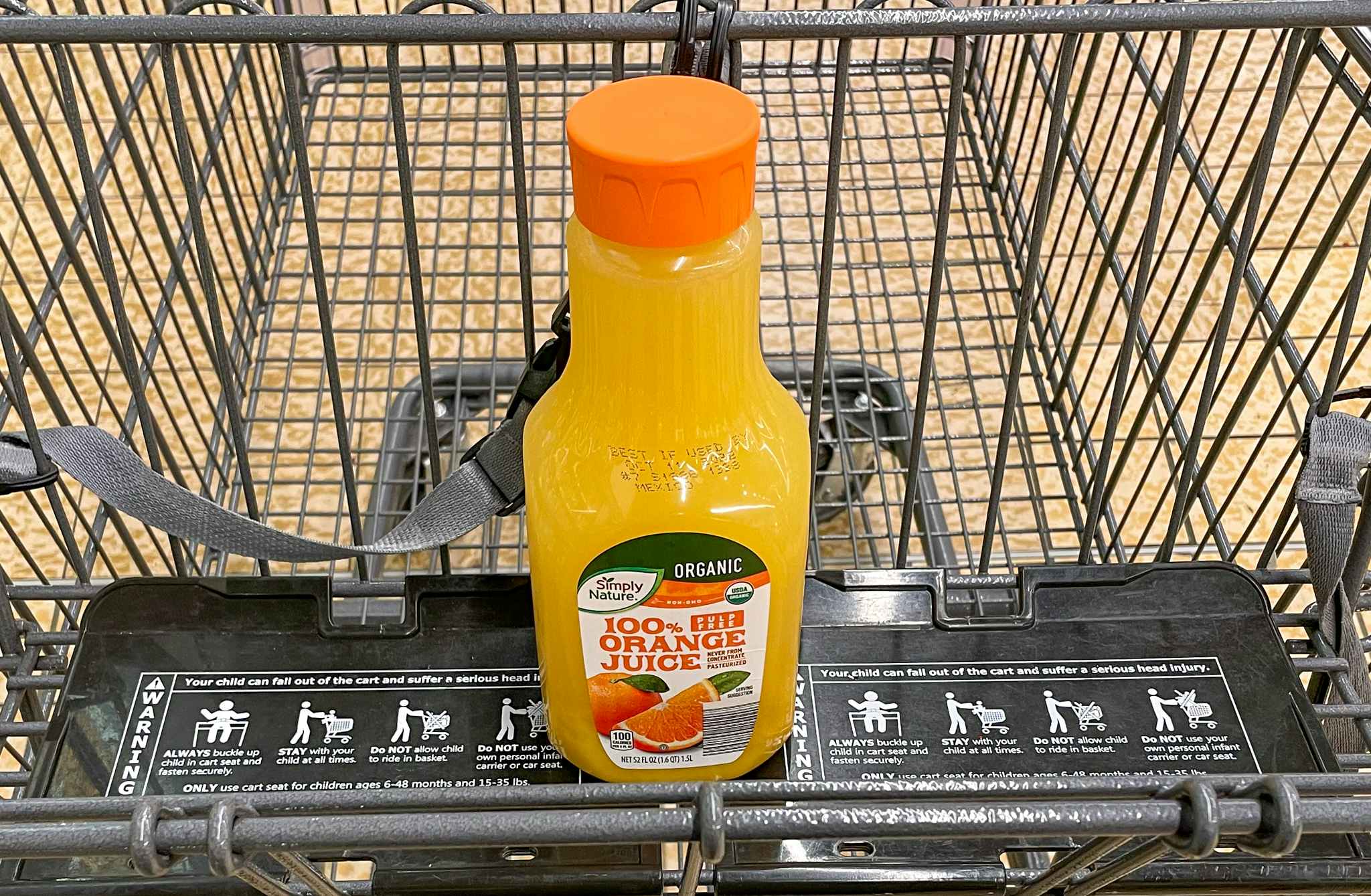 orange juice in a cart at aldi