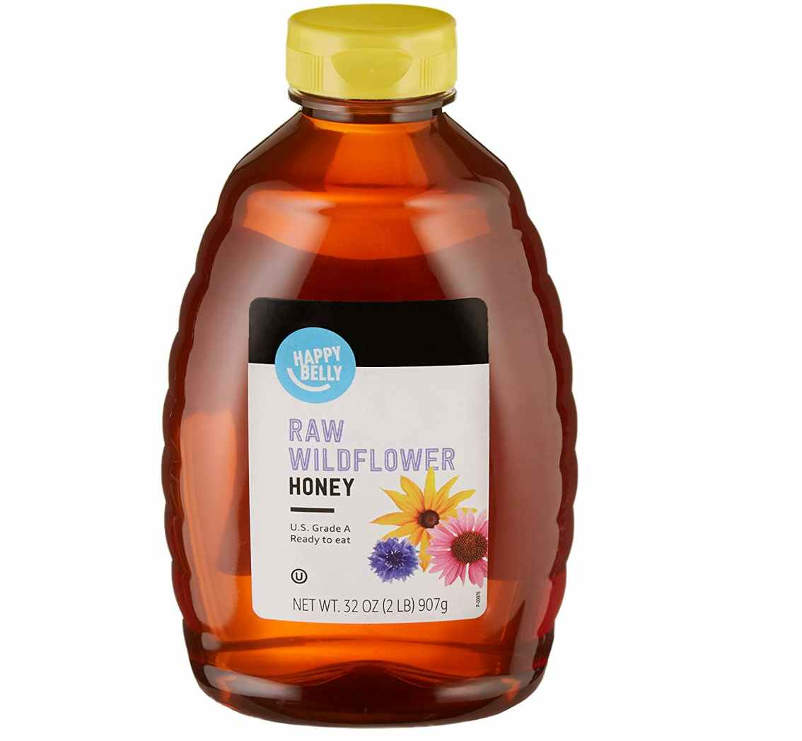 A bottle of honey on a white background