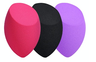 Three colorful sponges on a white background