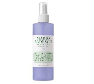Purple facial spray on a white background