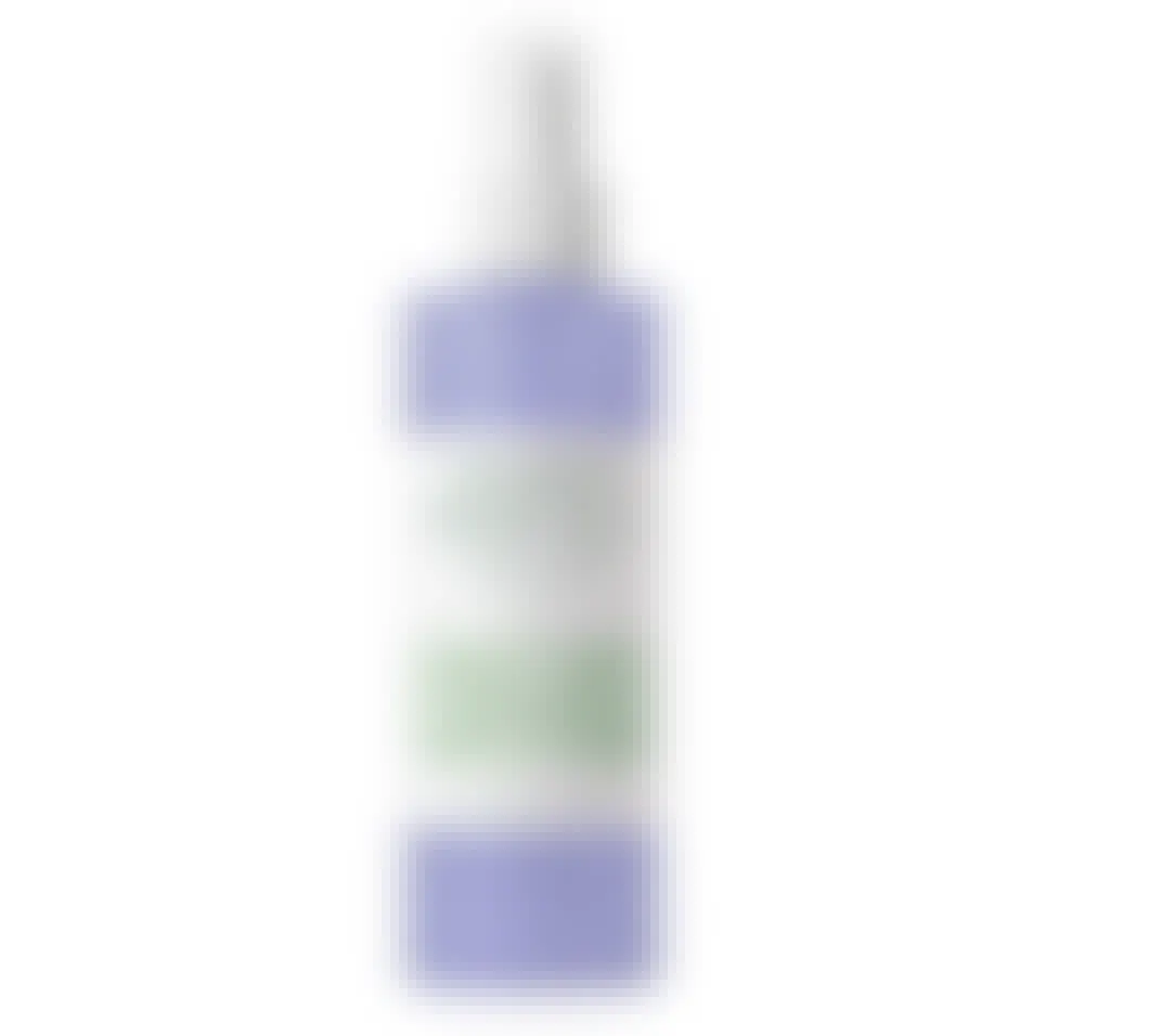 Purple facial spray on a white background