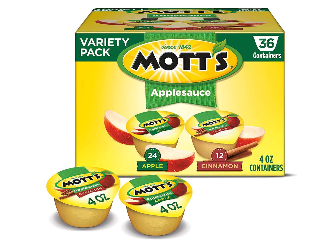 A box of apple sauce with two cups in the front