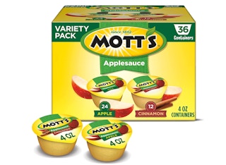 A box of apple sauce with two cups in the front