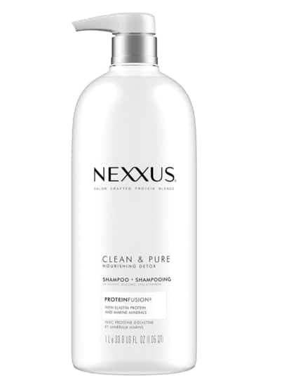 White bottle of shampoo on a white background