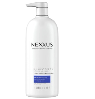 White bottle of conditioner on a white background