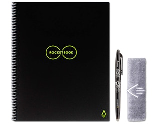 Black notebook, pen, and towel on a white background