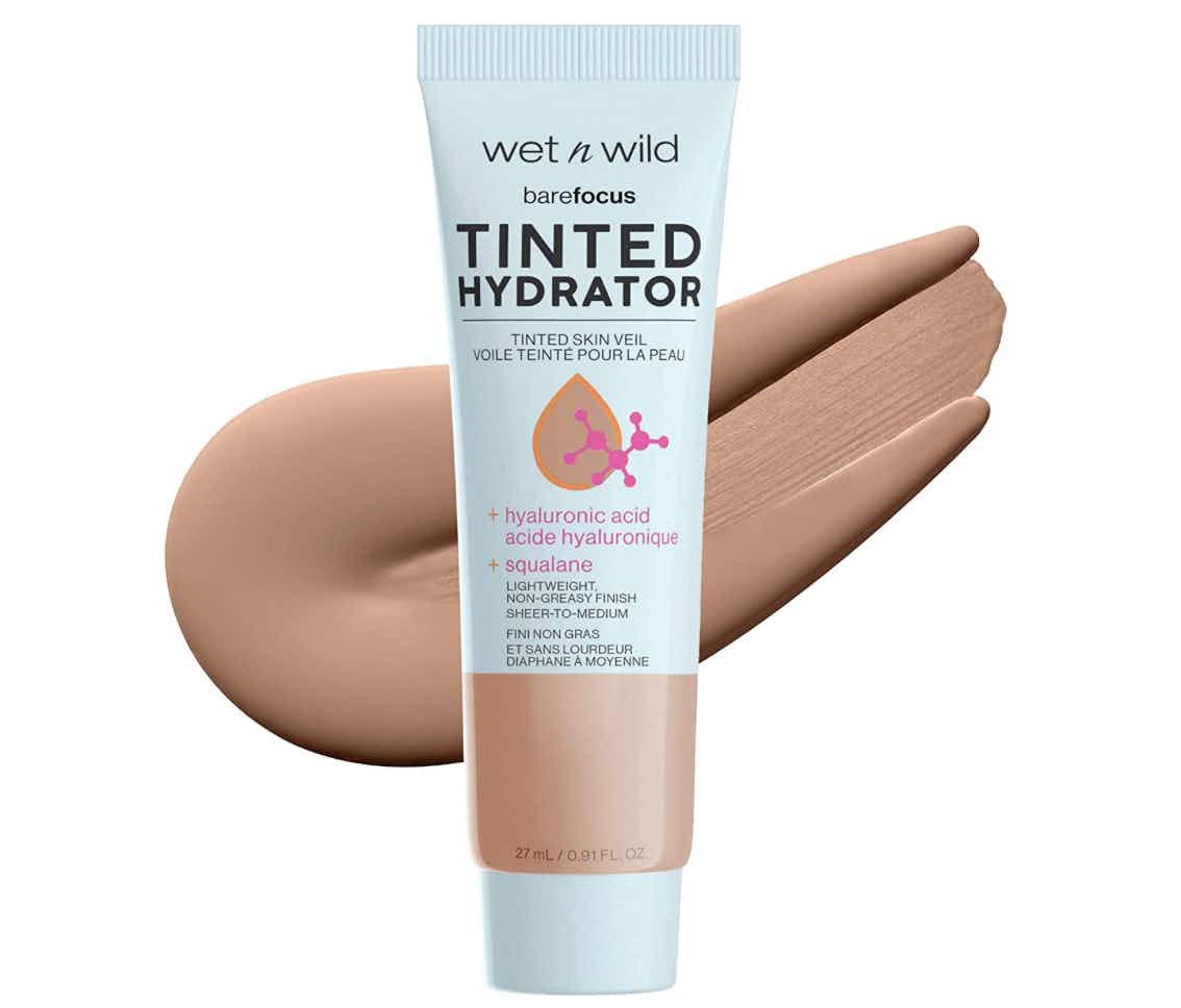 Tinted foundation bottle on a white background