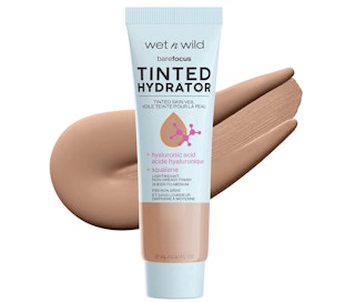 Tinted foundation bottle on a white background