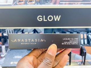 someone holding an anastasia beverly hills liquid glow box