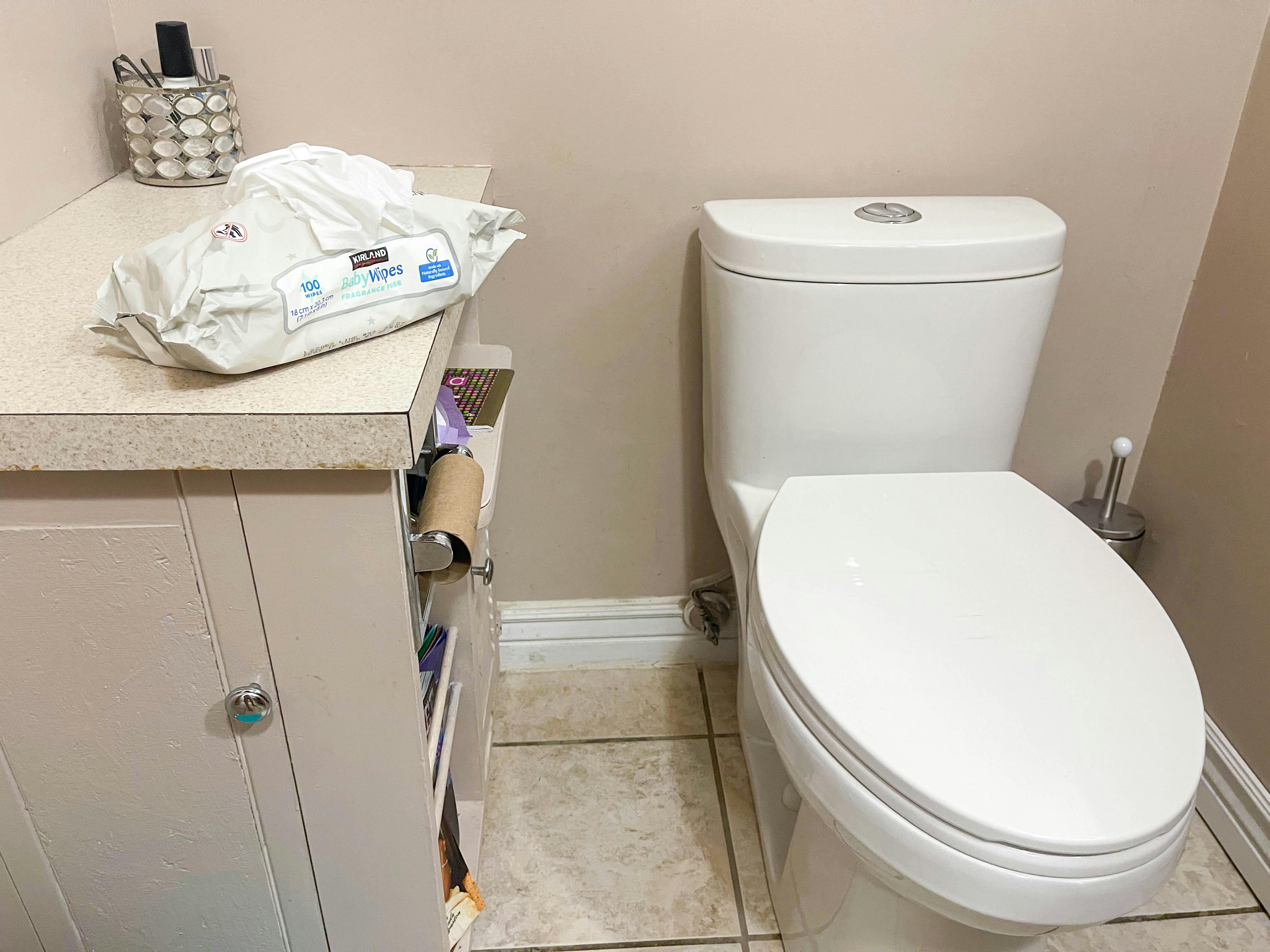baby wipes next to a toilet
