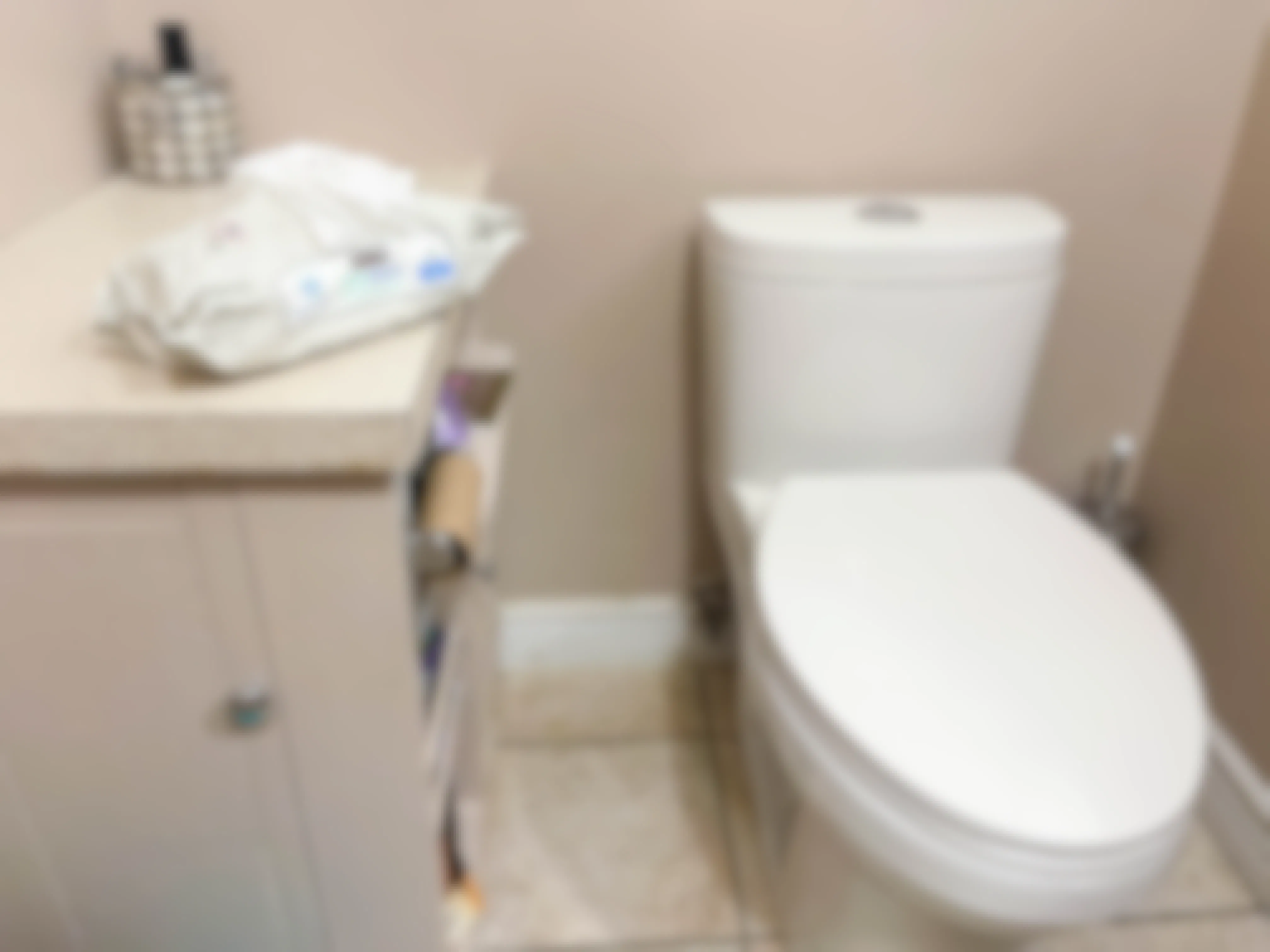 baby wipes next to a toilet 