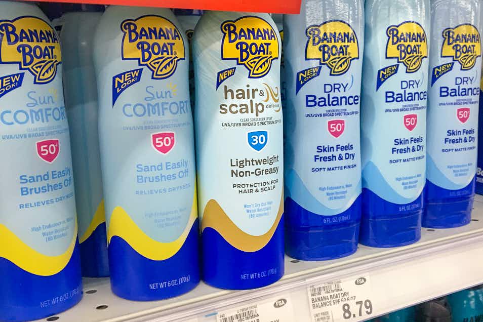 A bottle of Banana Boat Hair and Scalp sun screen on a shelf in a store