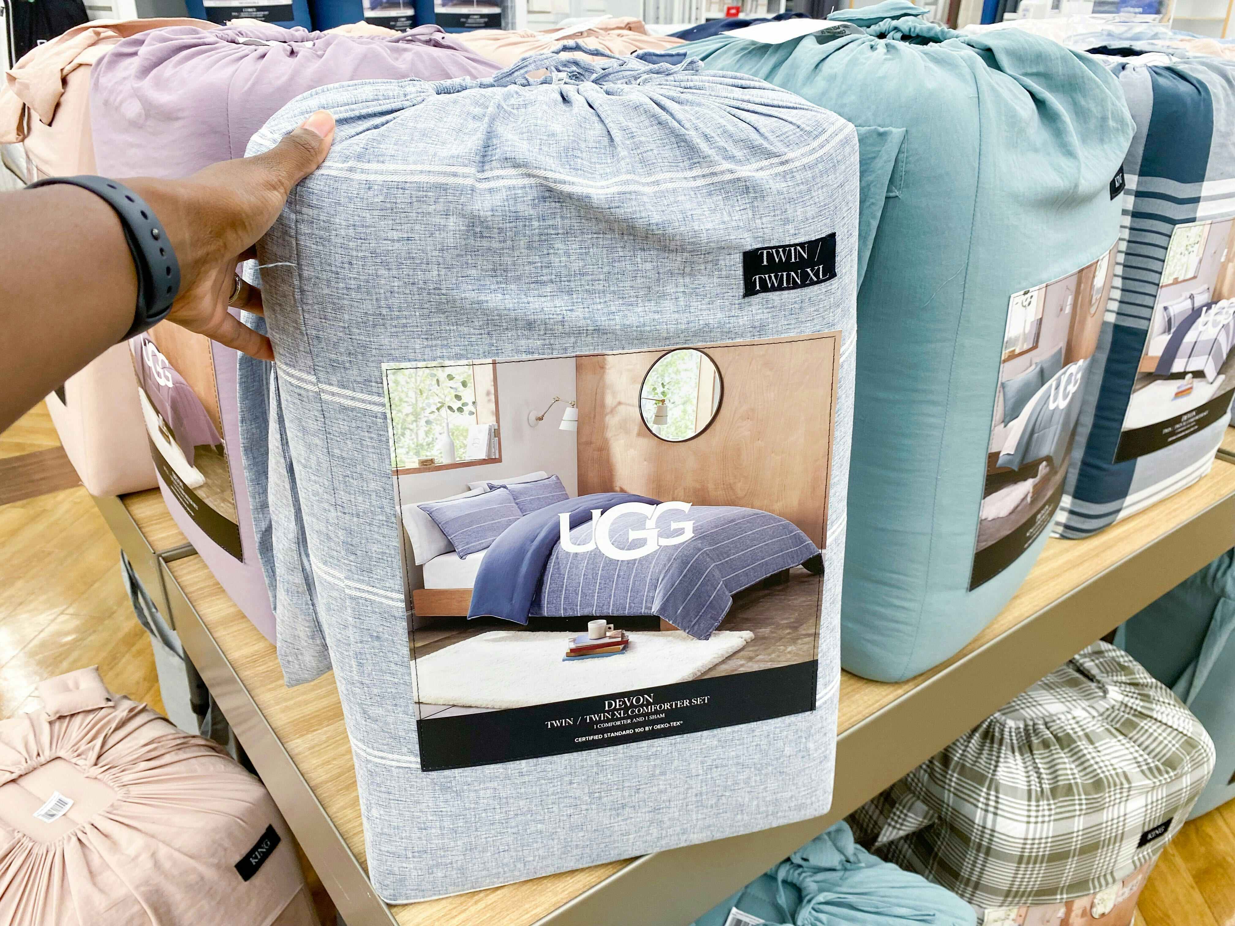 UGG comforter sets on a shelf