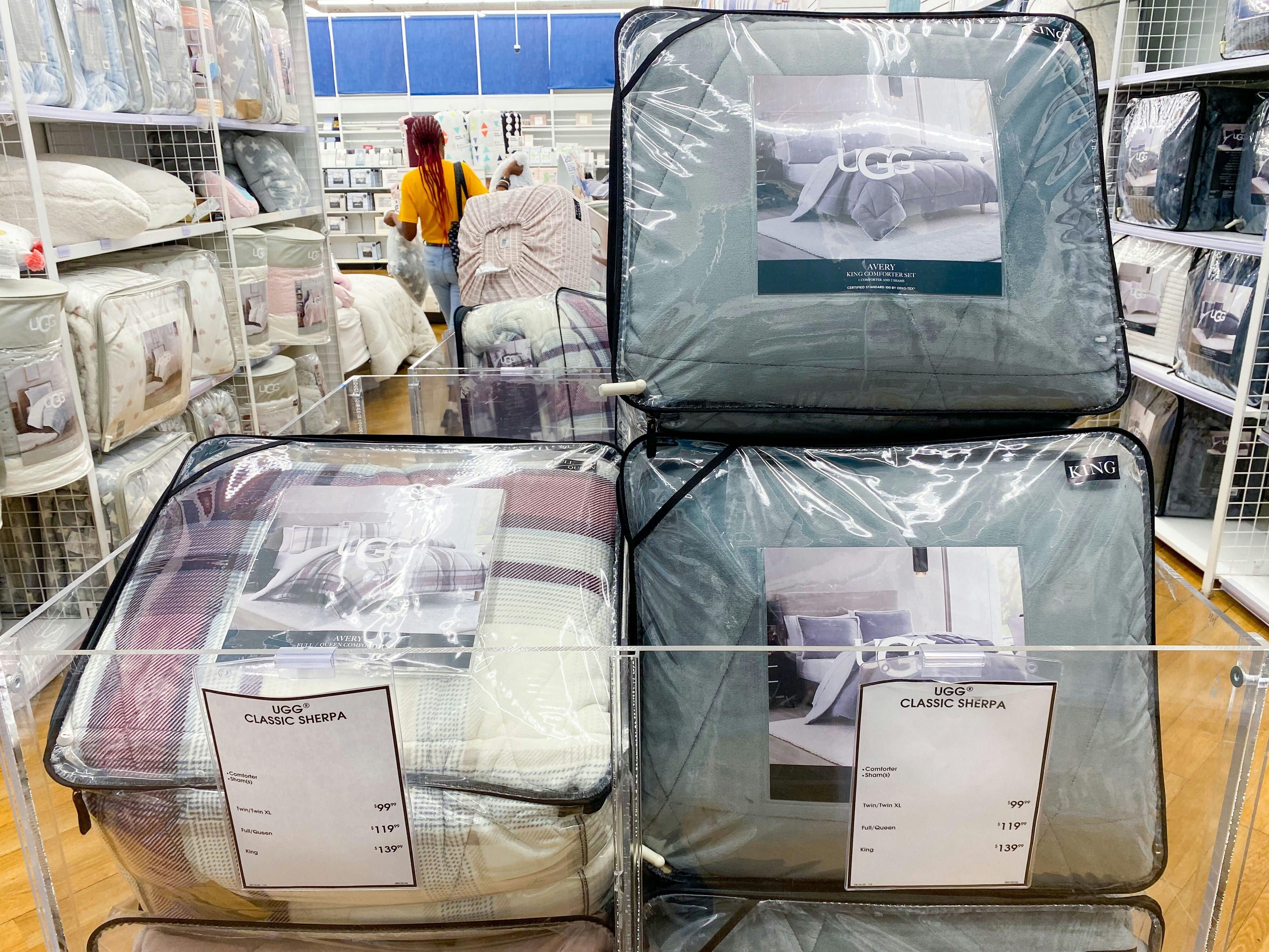 UGG comforter sets in a bin