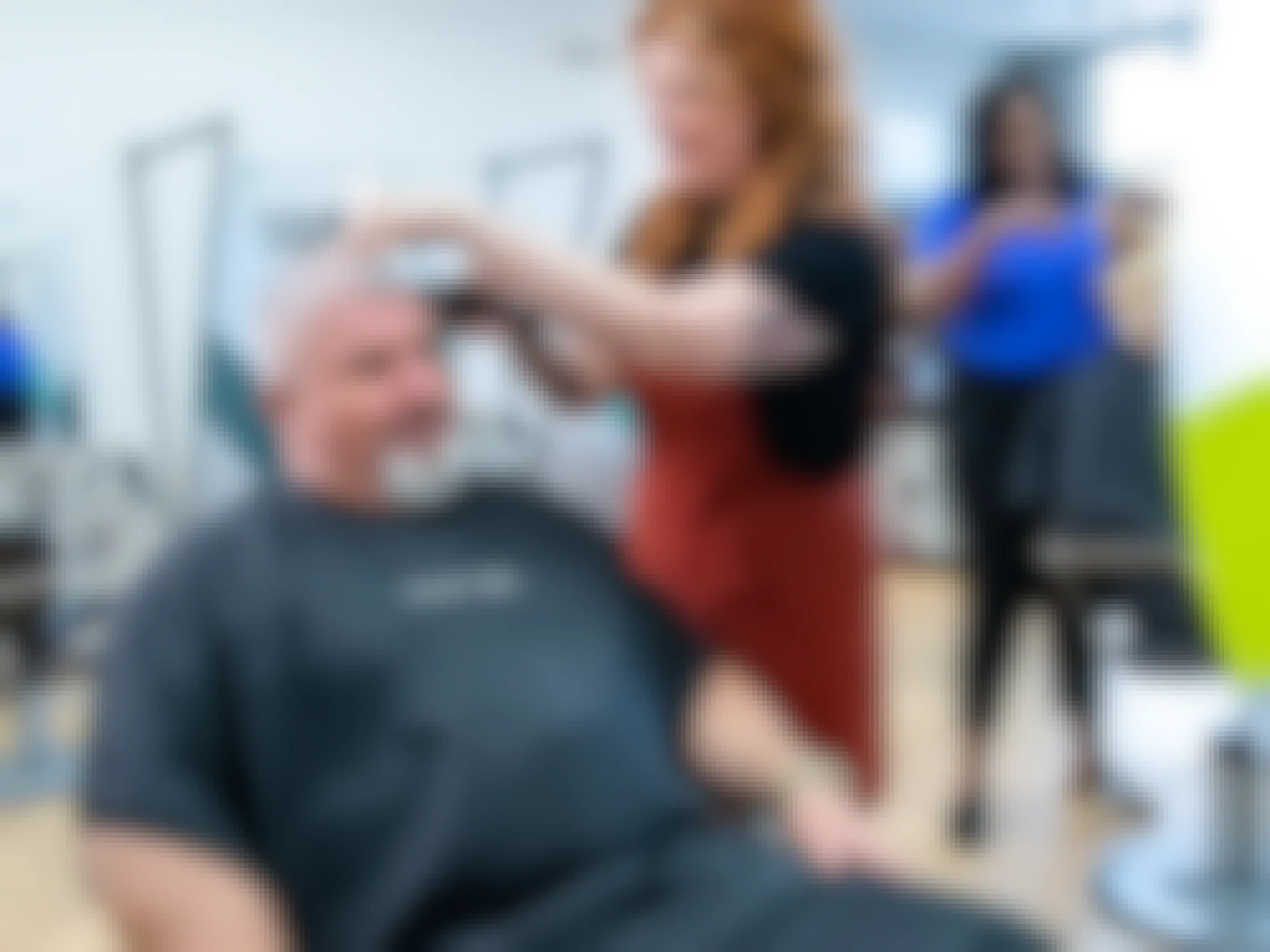 A Great Clips stylist cutting a man's hair