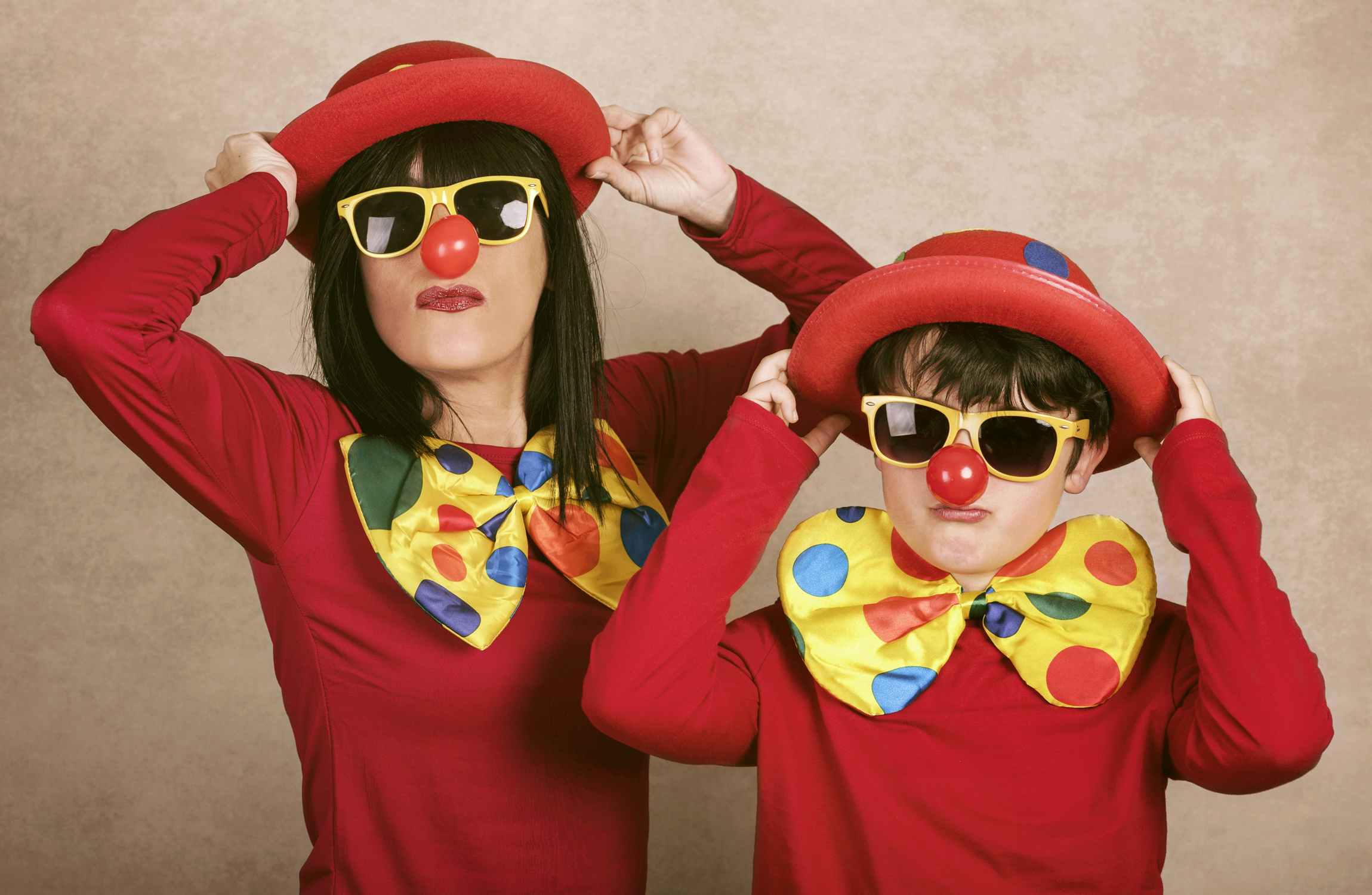 mother and son dressed in clown Halloween costumes