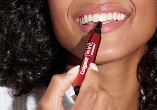 person using colgate optic white pen amazon prime day deal