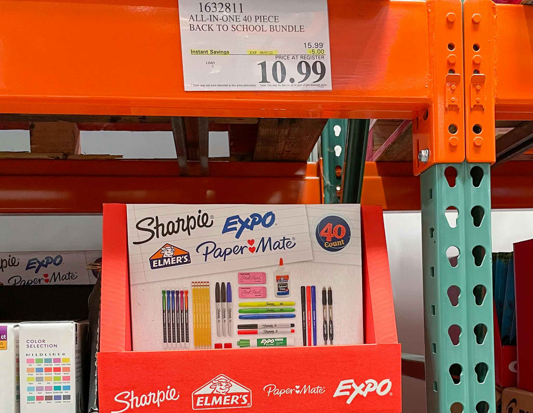 school supply bundle on a shelf at costco with sales sign
