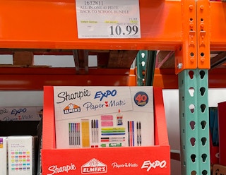 school supply bundle on a shelf at costco with sales sign