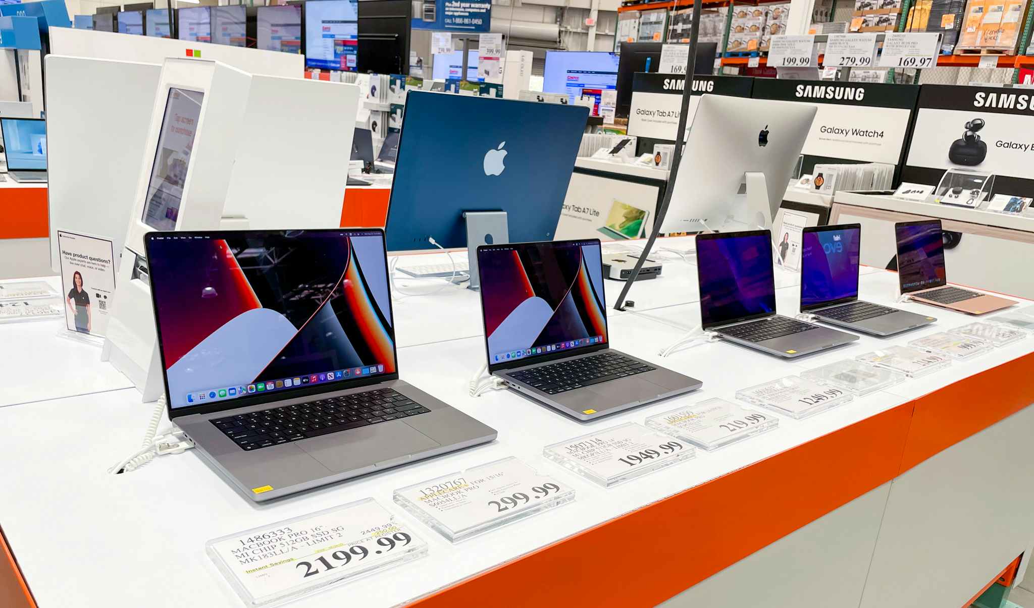 several macbooks on display at costco