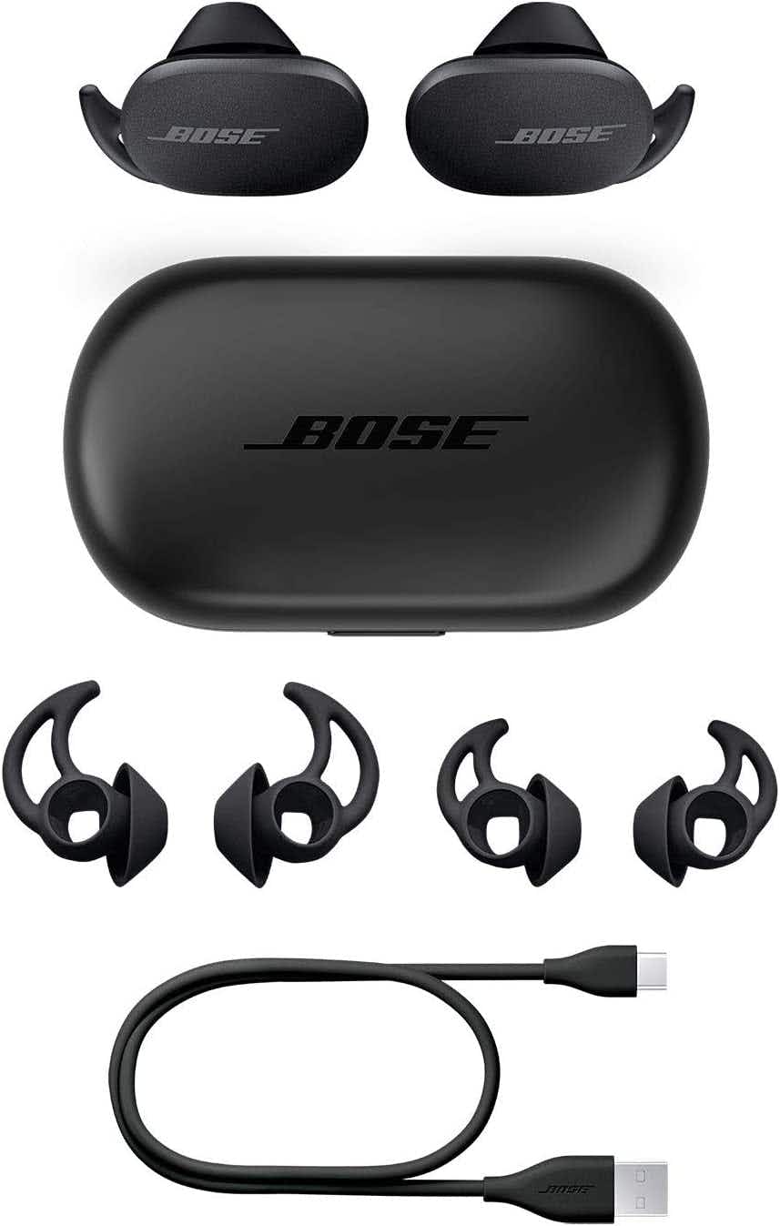 bose earbuds with charging case charger and replacement buds on a white background