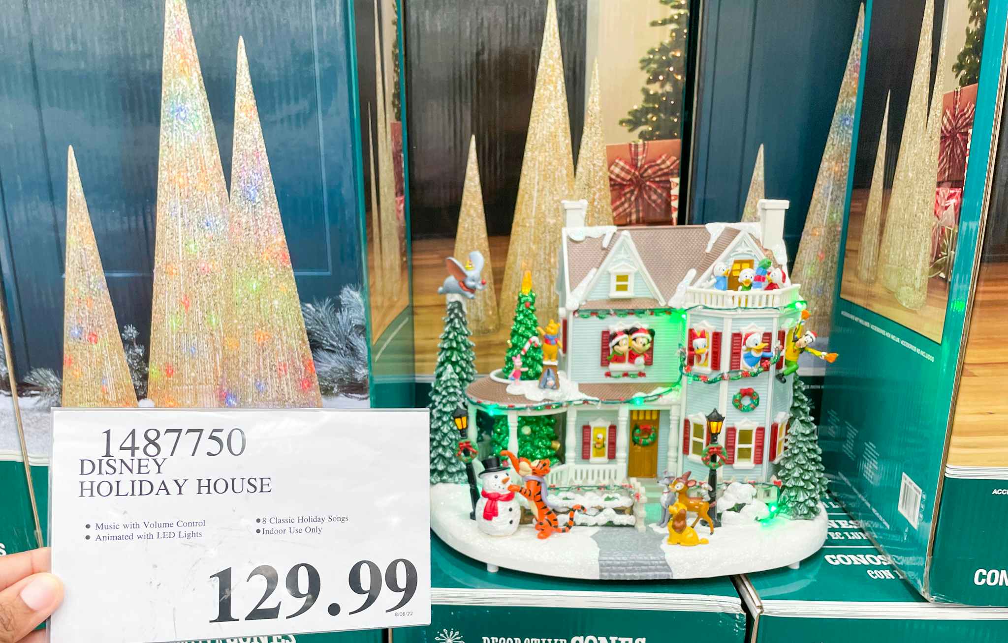 disney holiday house on display with sale sigh at costco