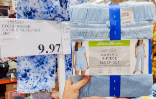 eddie bauer pajamas hand held near sales sign
