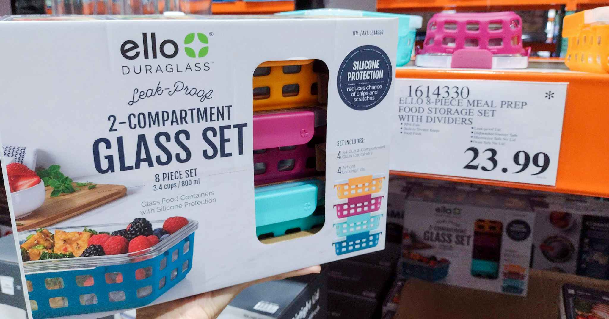 glass container set held in hand near sales sign at costco