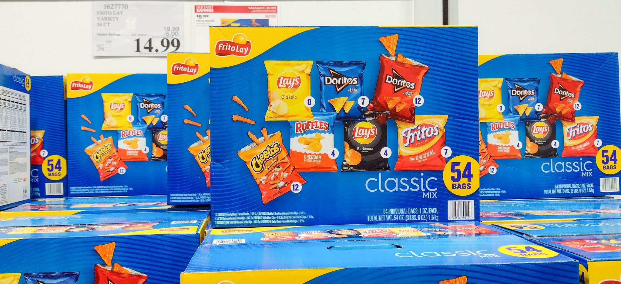 boxes of chips stacked up near sales sign