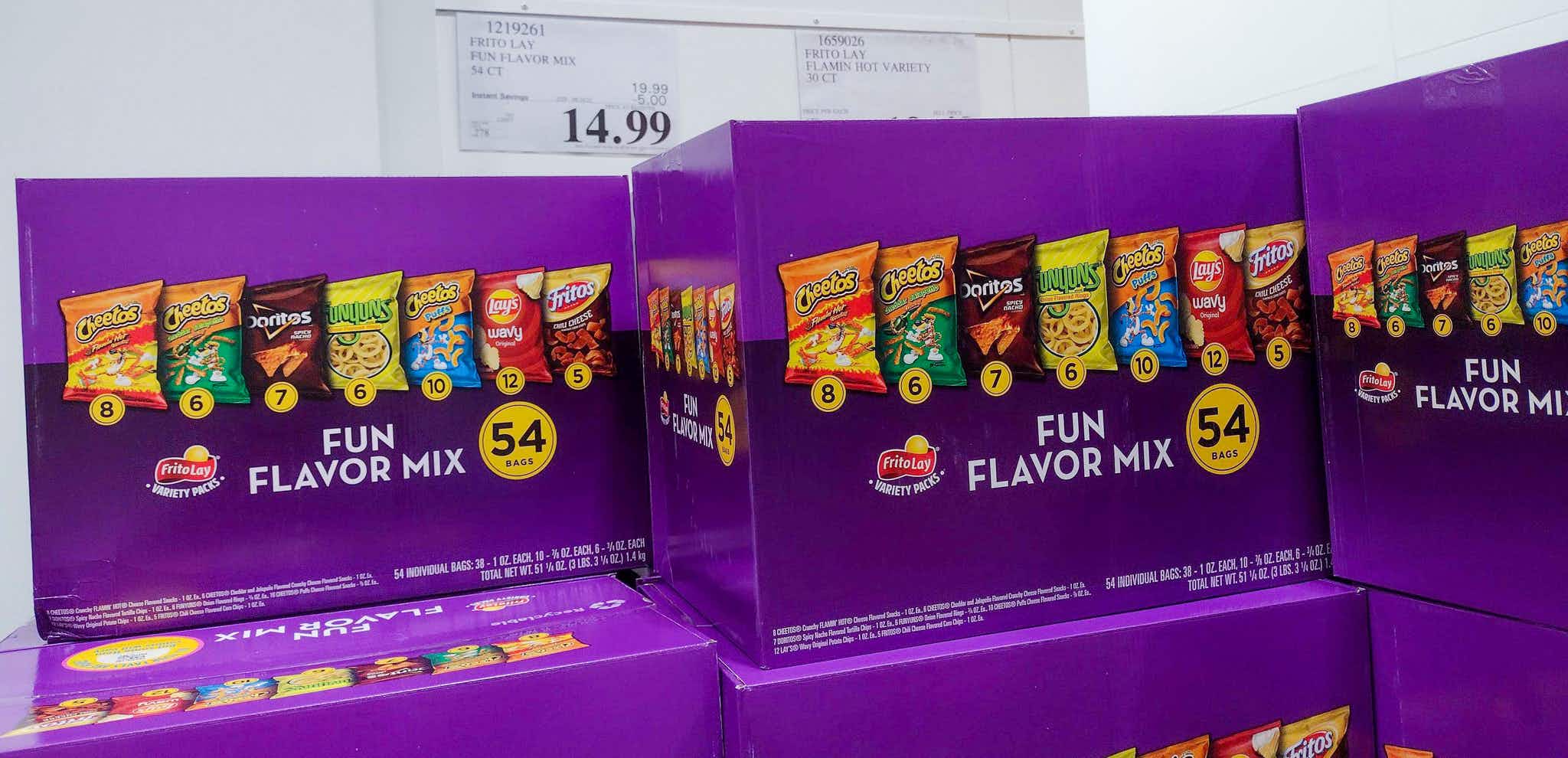 boxes of chips stacked up with sales sign at costco